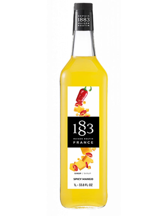 1883 Spicy Mango sirup – en intens og eksotisk smag af mango med et krydret twist, perfekt til at skabe unikke og varme drinks