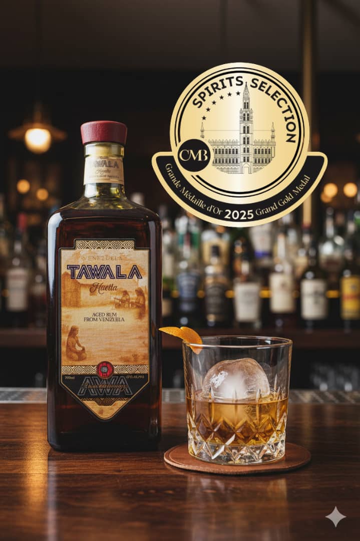 Tawala Huella rum with a serving glass and 2025 Grand Gold award
